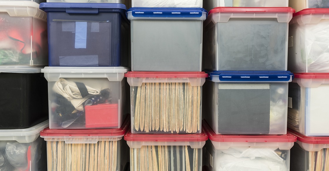 Clear storage bins help with storage locker organization.