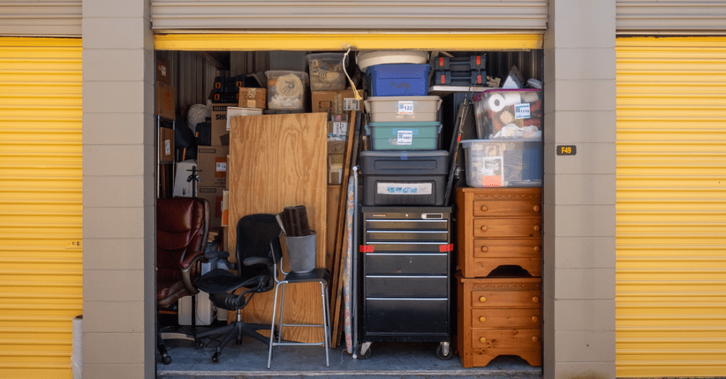 Contents of a house packed into a storage unit with the door open