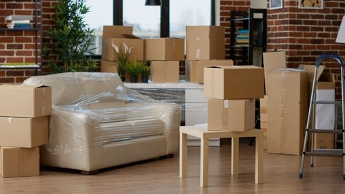 Storing furniture for a room, including a wrapped couch